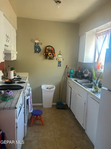 a kitchen with a sink and cabinets