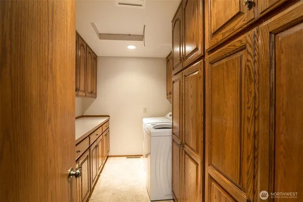 a view of a hallway and wooden floor