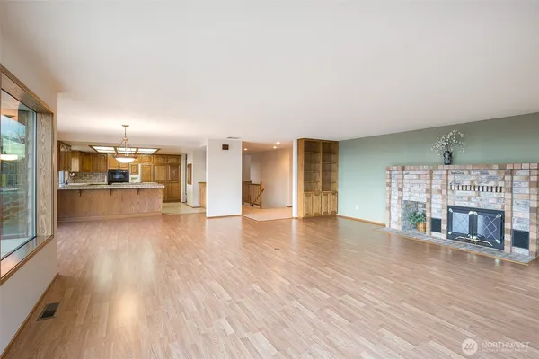 a view of kitchen with furniture and wooden floor