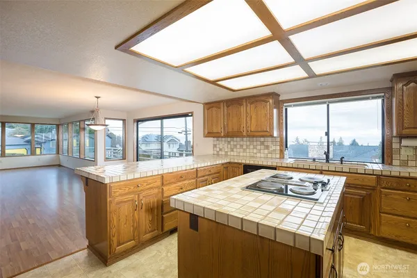 a kitchen with a stove a sink and a refrigerator