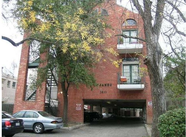 2811 Rio Grande Street, Unit 303 Austin, TX 78705 - Photo 10 of 11 a front view of a house with a garden