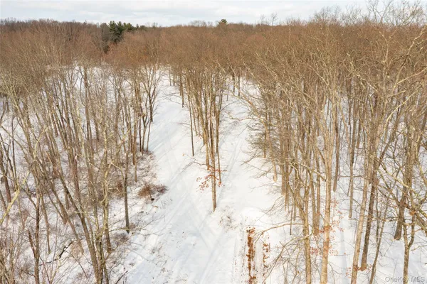 a view of snow on the road