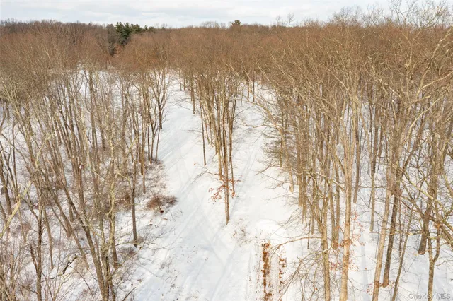 a view of snow on the road