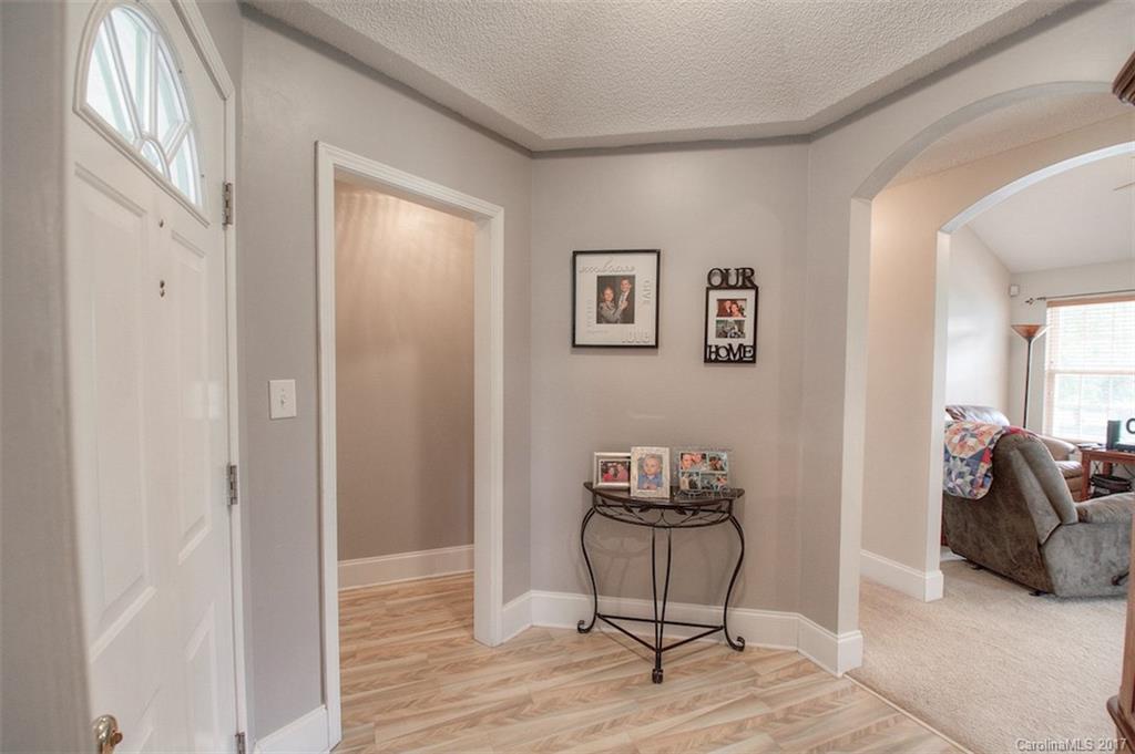 6114 Olive Branch Road Wingate, NC 28174 - Photo 11 of 24 a view of a livingroom with furniture and wooden floor