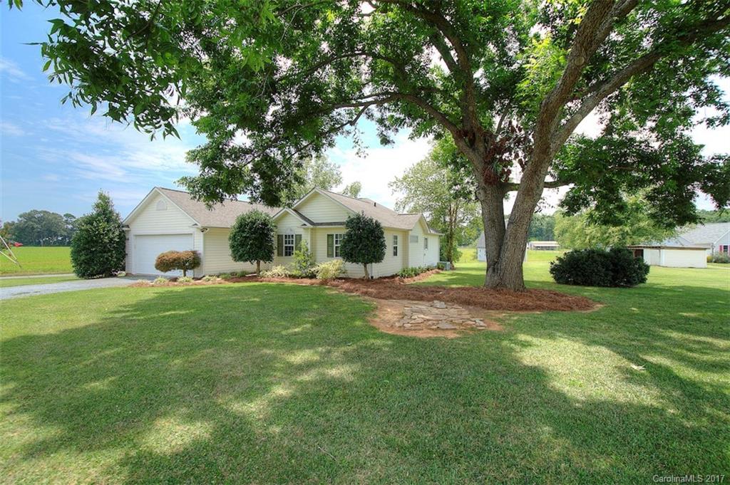 6114 Olive Branch Road Wingate, NC 28174 - Photo 3 of 24 a front view of a house with yard and green space