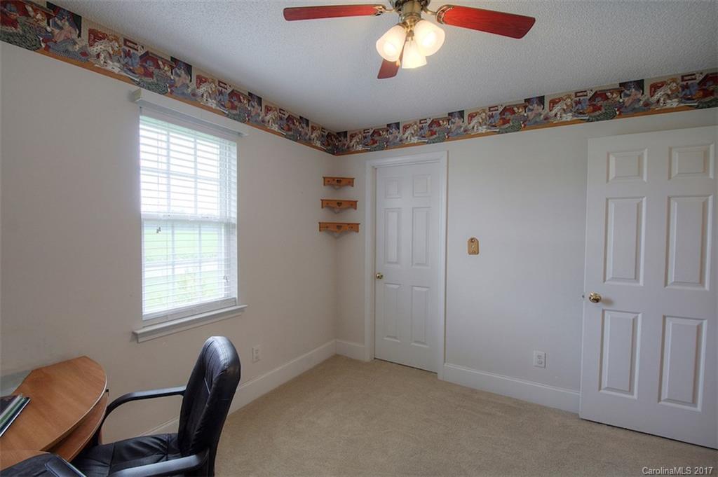 6114 Olive Branch Road Wingate, NC 28174 - Photo 24 of 24 a view of a livingroom with workspace and windows
