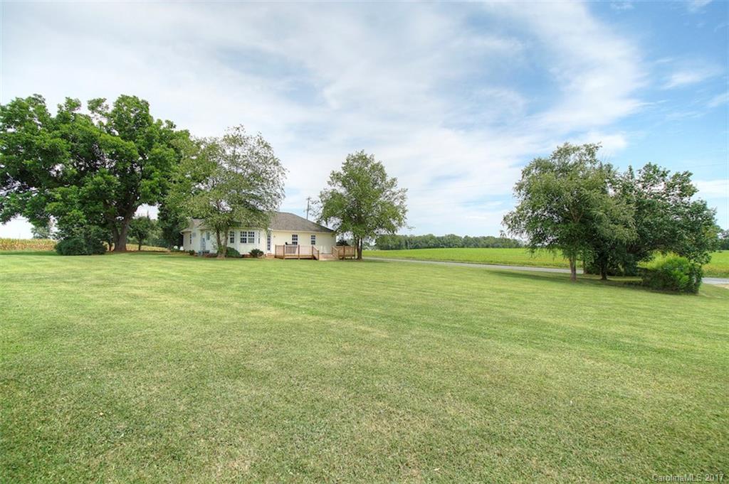 6114 Olive Branch Road Wingate, NC 28174 - Photo 4 of 24 a view of yard with swimming pool and green space