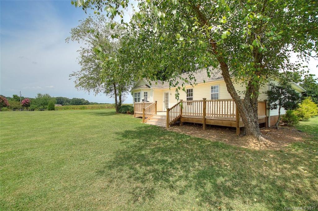 6114 Olive Branch Road Wingate, NC 28174 - Photo 5 of 24 a view of a garden with trees