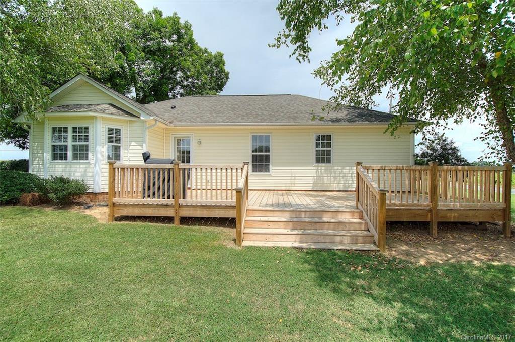 6114 Olive Branch Road Wingate, NC 28174 - Photo 7 of 24 a view of a house with a yard and deck