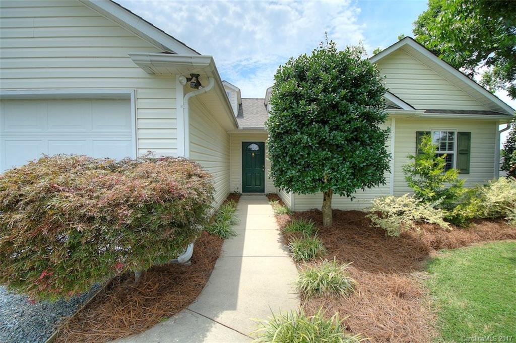 6114 Olive Branch Road Wingate, NC 28174 - Photo 10 of 24 a front view of a house with garden