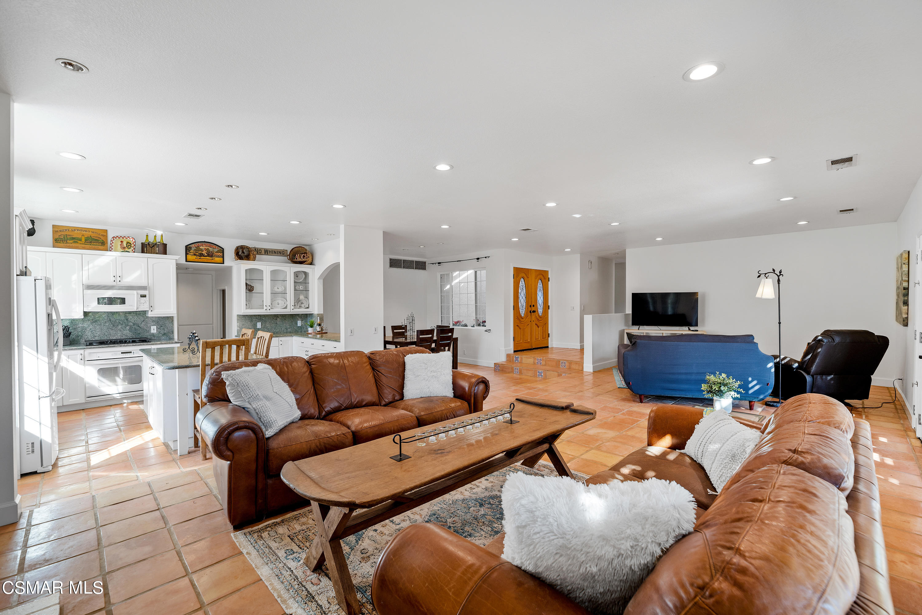 1704 Rambling Road Simi Valley, CA 93065 - Photo 11 of 40 a living room with furniture and a view of kitchen