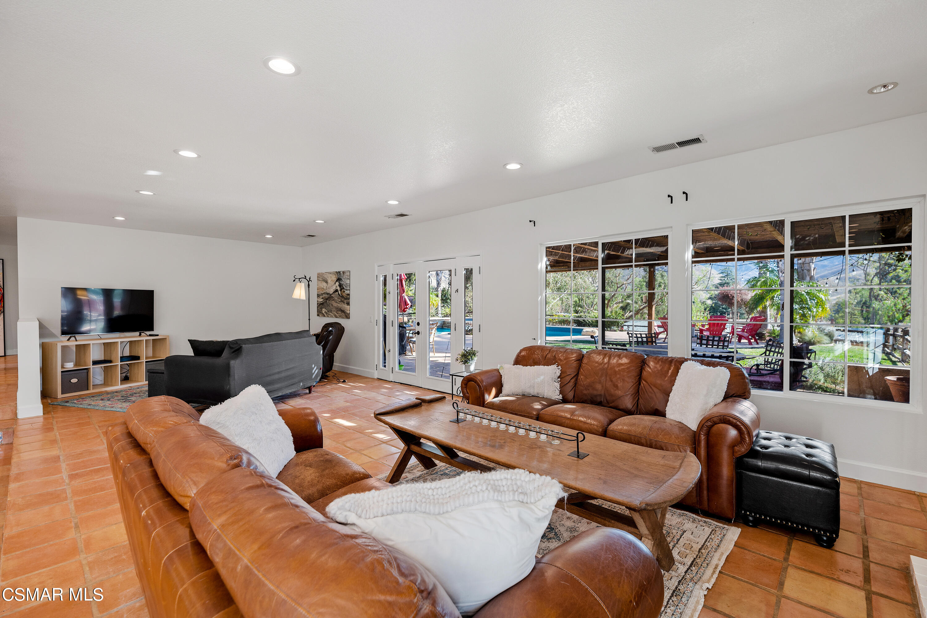 1704 Rambling Road Simi Valley, CA 93065 - Photo 12 of 40 a living room with furniture and a flat screen tv