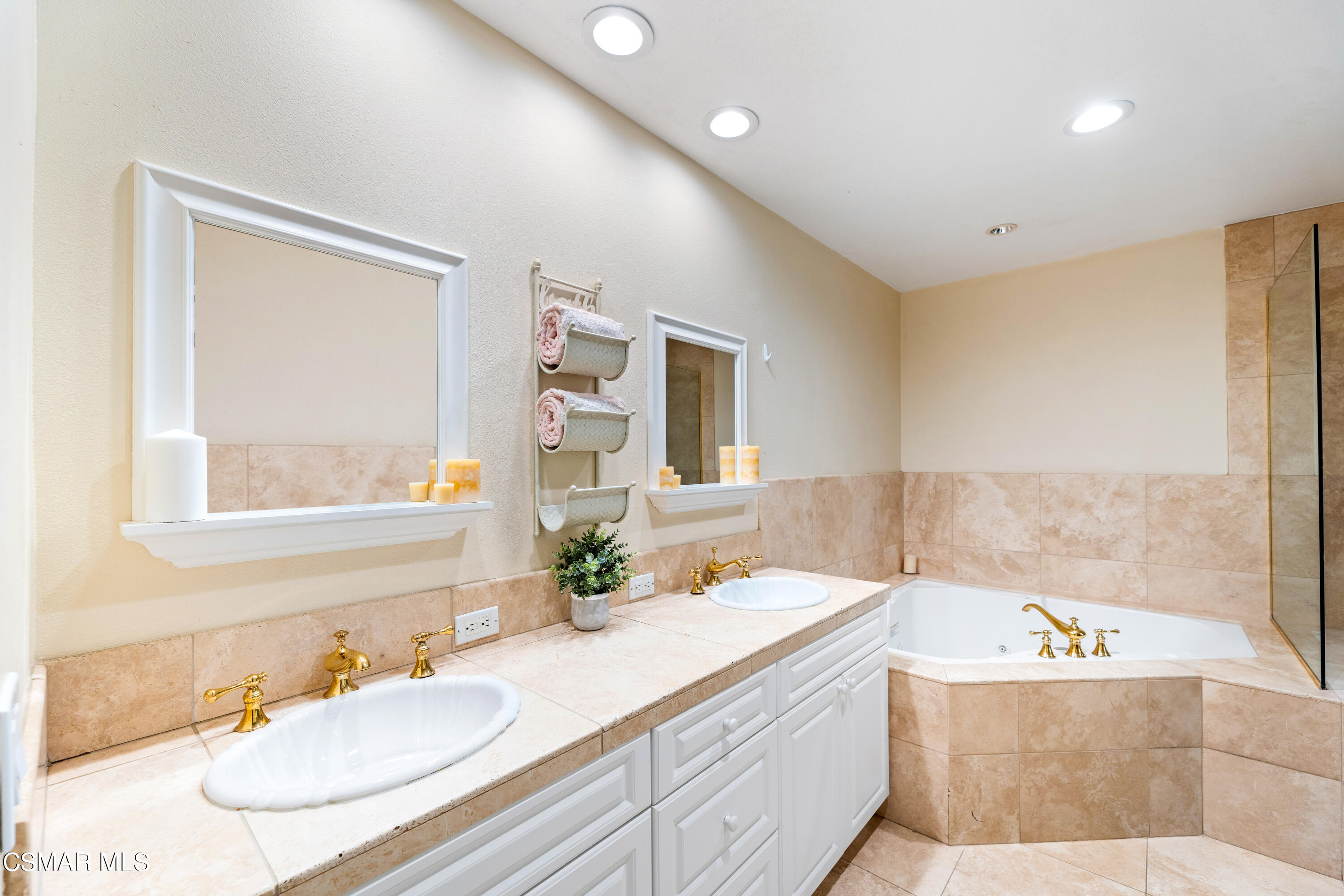 1704 Rambling Road Simi Valley, CA 93065 - Photo 15 of 40 a bathroom with a granite countertop sink and a mirror