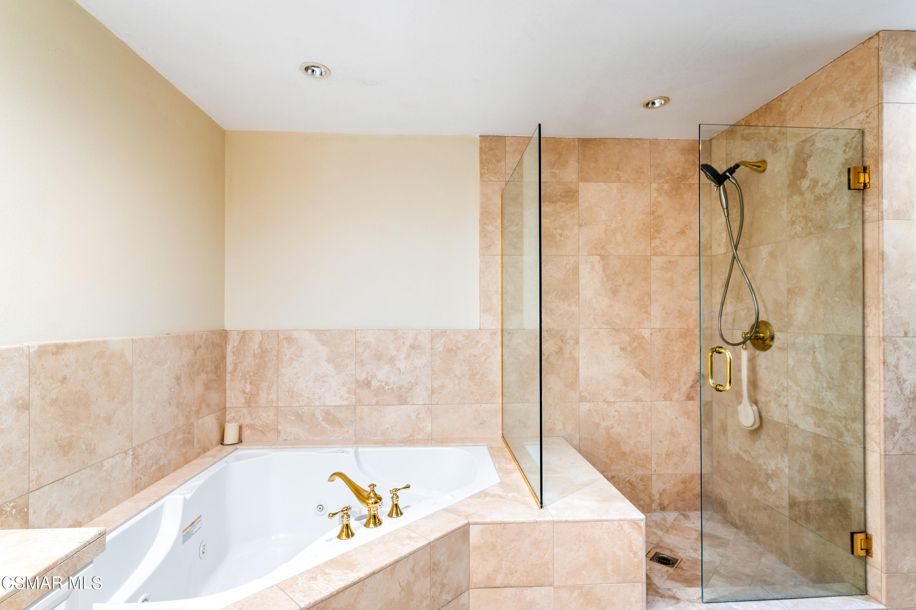 1704 Rambling Road Simi Valley, CA 93065 - Photo 16 of 40 a bathroom with a bathtub and a shower