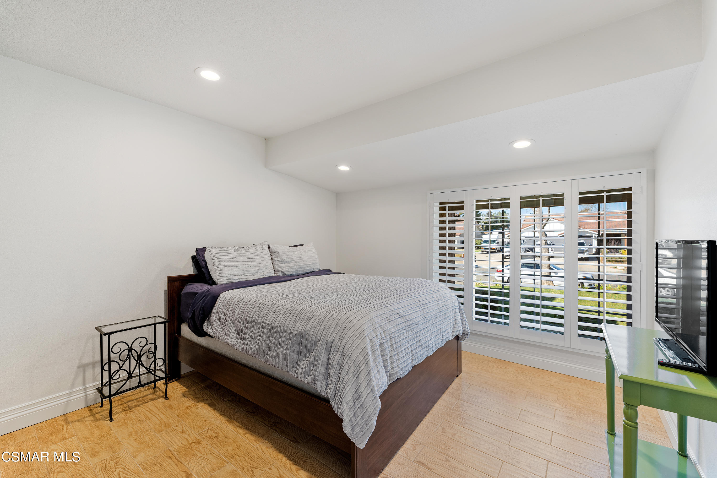 1704 Rambling Road Simi Valley, CA 93065 - Photo 17 of 40 a bedroom with a bed and a night stand