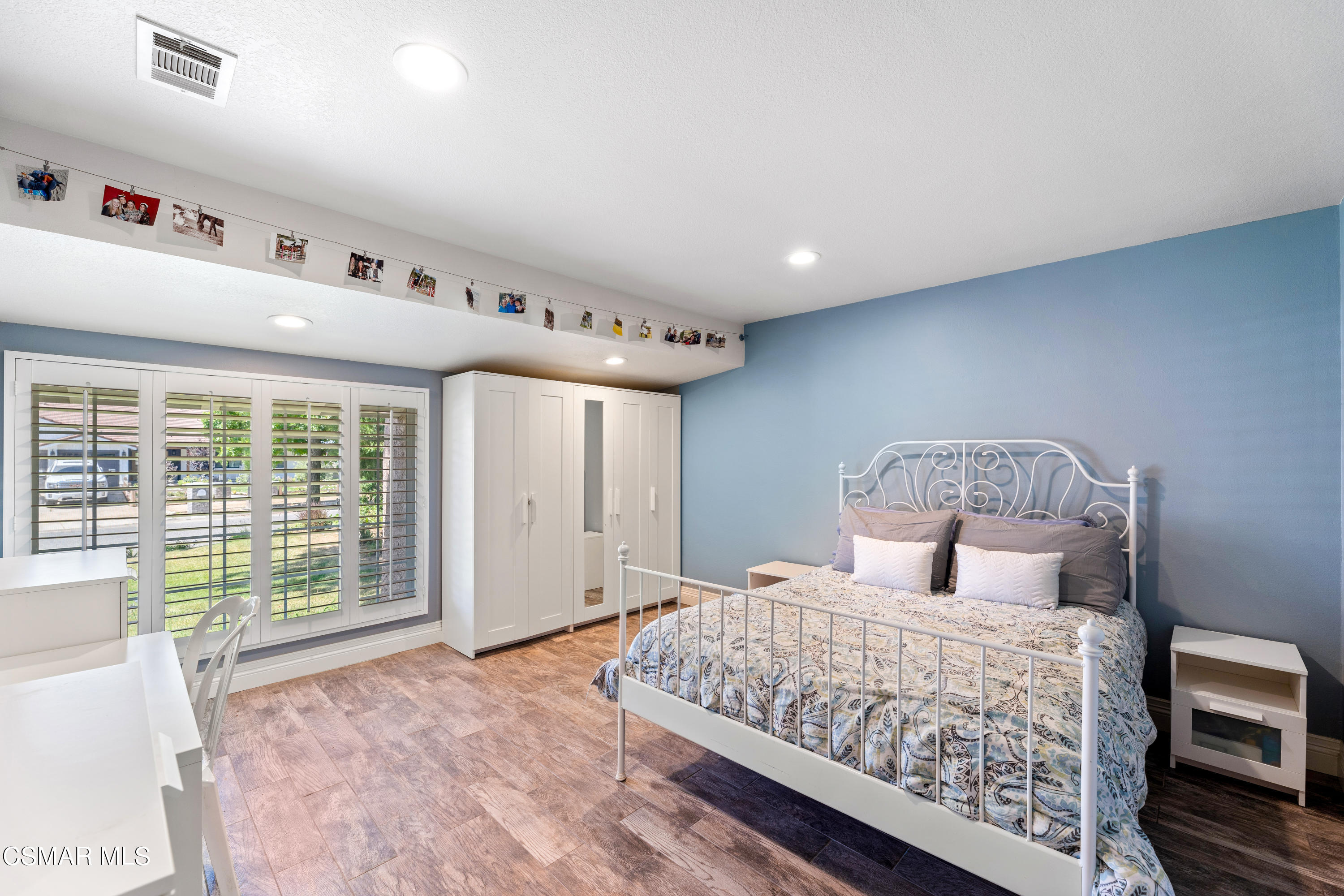 1704 Rambling Road Simi Valley, CA 93065 - Photo 18 of 40 a bedroom with a large bed and a large window