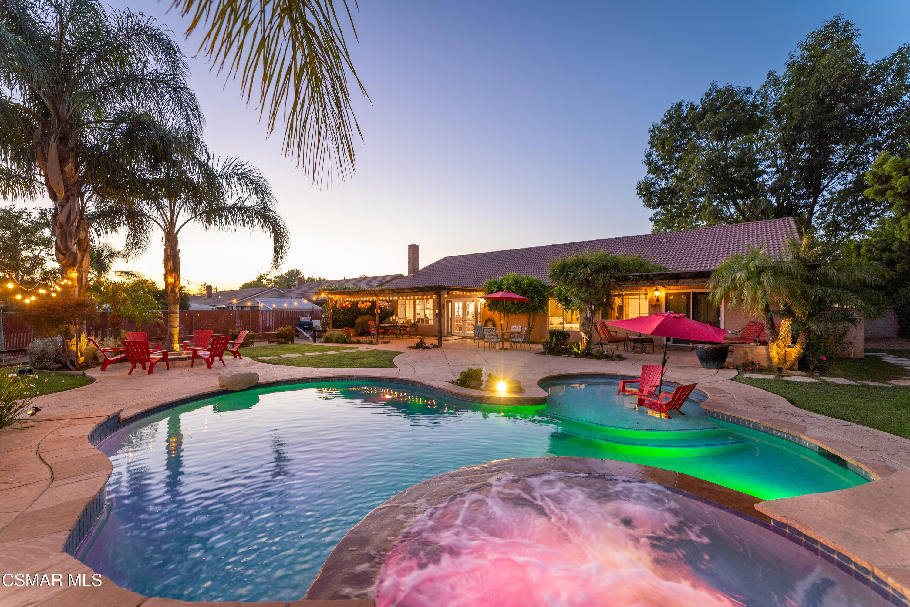 1704 Rambling Road Simi Valley, CA 93065 - Photo 20 of 40 a view of a swimming pool with lounge chairs in front of a house