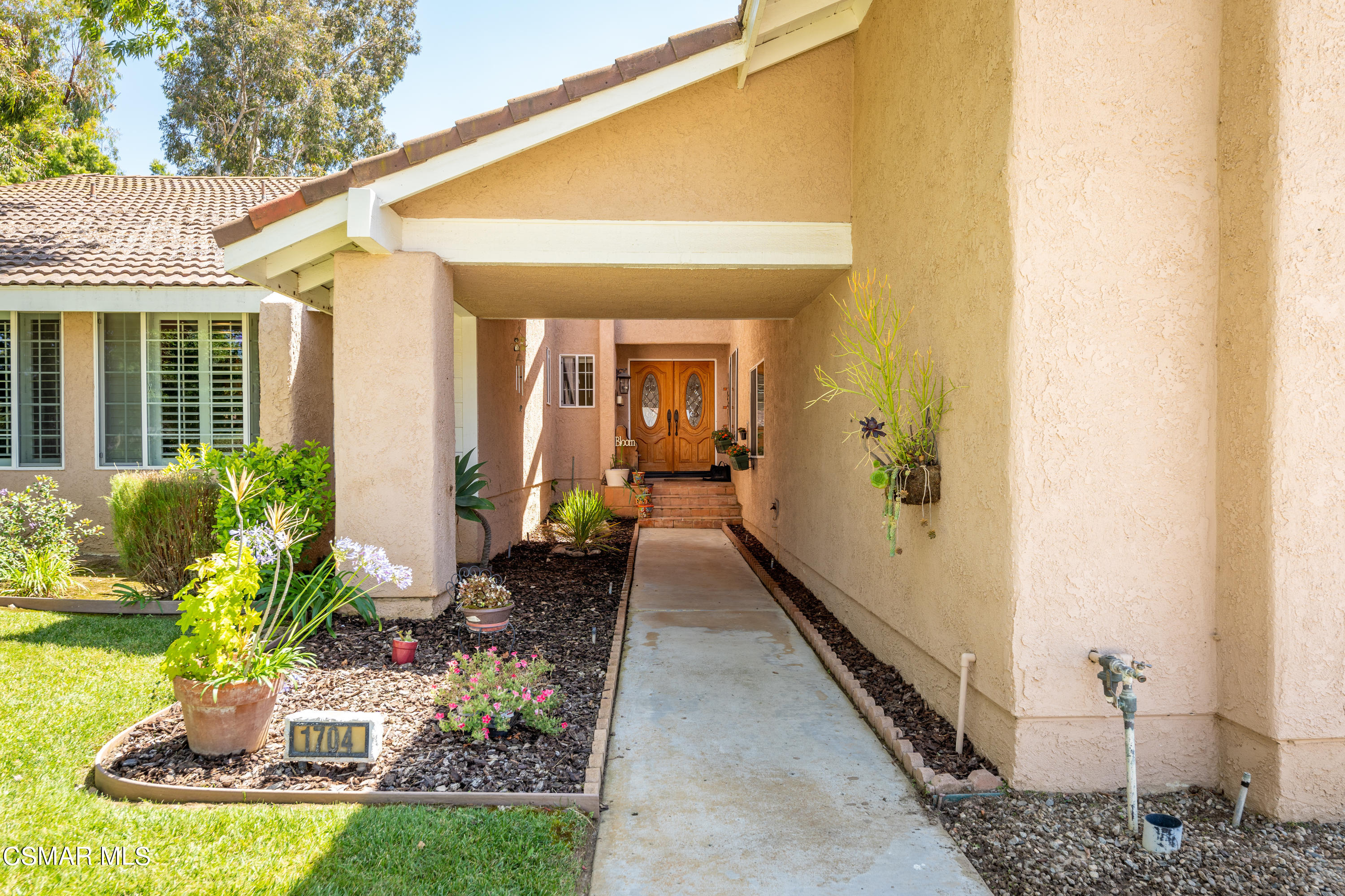 1704 Rambling Road Simi Valley, CA 93065 - Photo 3 of 40 a view of a porch with chairs and potted plants