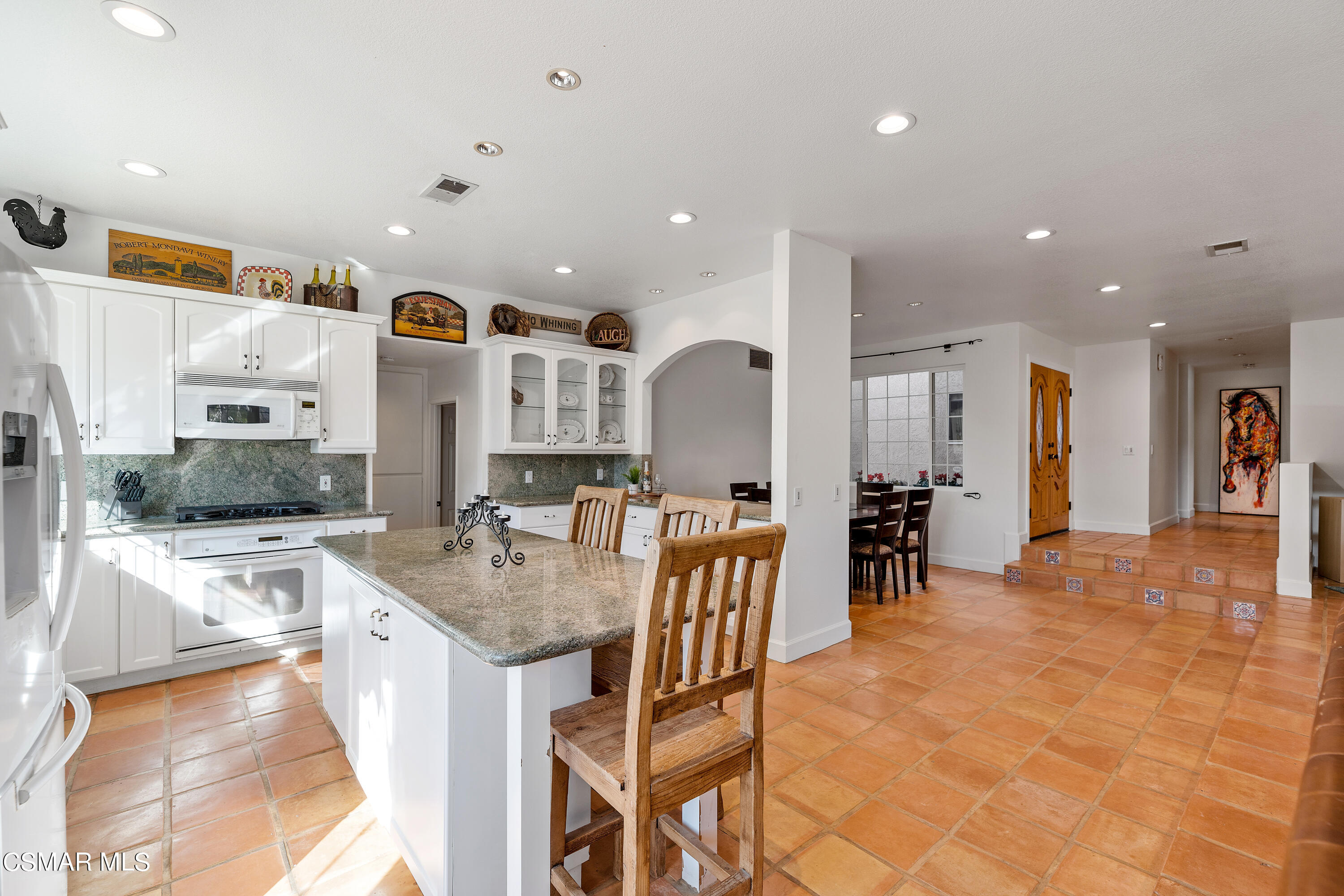 1704 Rambling Road Simi Valley, CA 93065 - Photo 6 of 40 a kitchen with stainless steel appliances kitchen island granite countertop a sink and cabinets