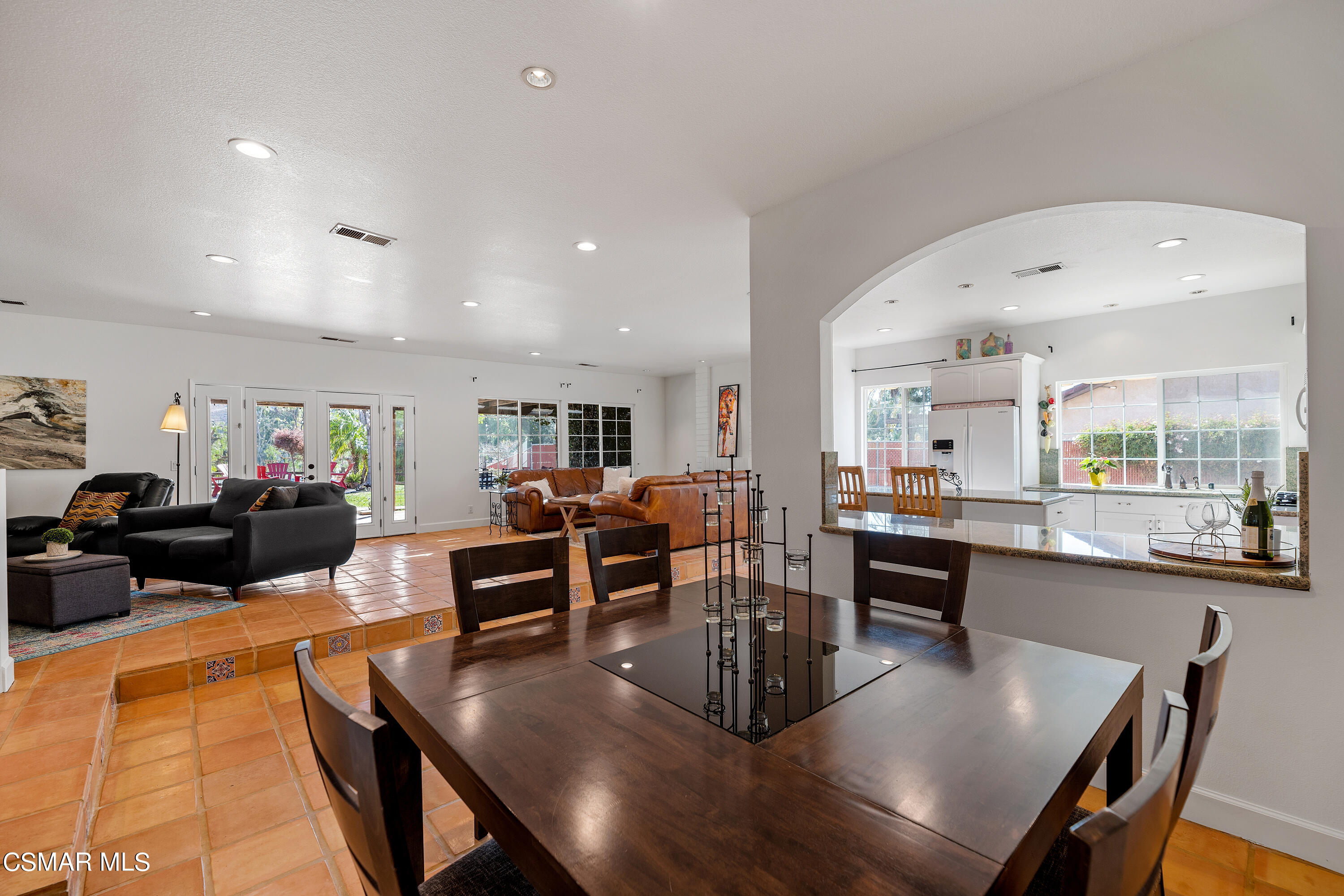 1704 Rambling Road Simi Valley, CA 93065 - Photo 10 of 40 a living room with furniture dining table and kitchen view