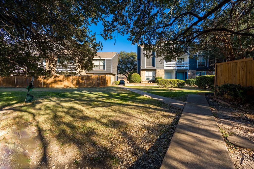 5840 Spring Valley Road, Unit 212 Dallas, TX 75254 - Photo 27 of 32 a view of a house with backyard porch and sitting area