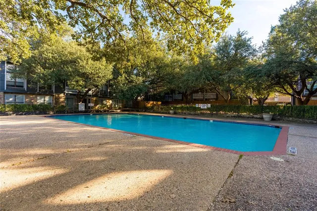 a view of a yard with swimming pool