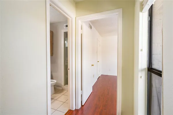 a view of a bathroom from a hallway
