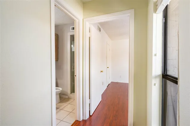 a view of a bathroom from a hallway