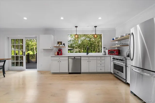 a kitchen with a refrigerator and a sink