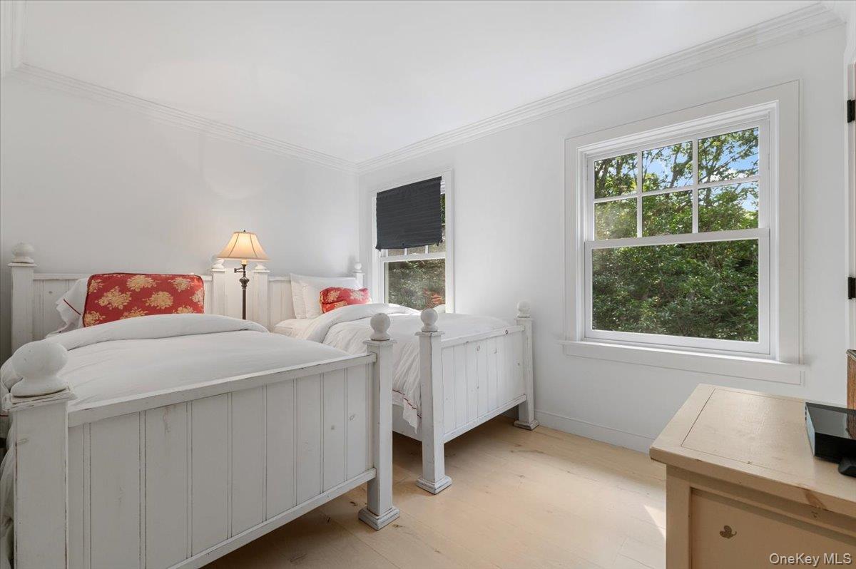 22 West Gate Road Wainscott, NY 11975 - Photo 23 of 42 a bedroom with a bed and a window