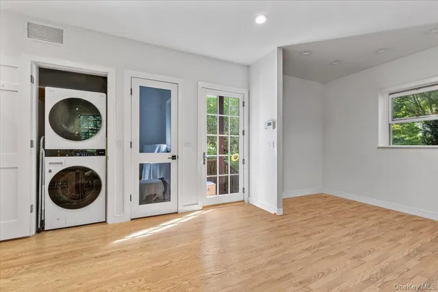 a view of a hallway with washer and dryer