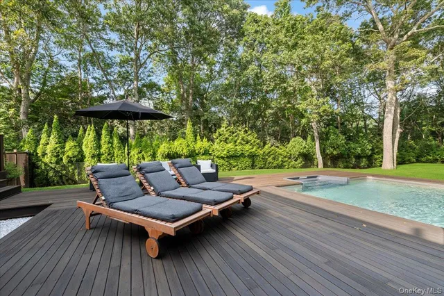 a view of a swimming pool with a patio