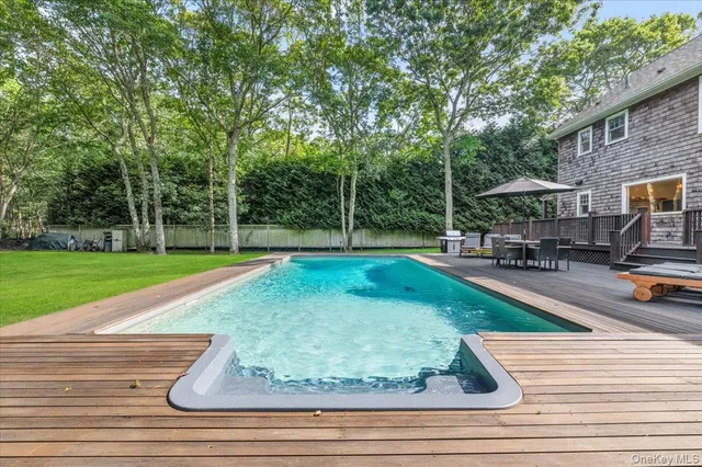 a view of a park with large trees and a lots of trees