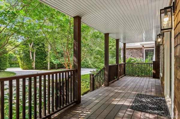 a view of a porch with wooden floor and outdoor space