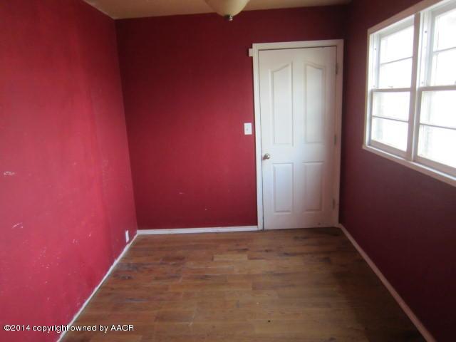 5107 Crockett Street Amarillo, TX 79110 - Photo 8 of 12 an empty room with windows