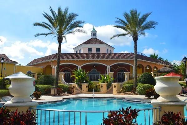 122 Capri Drive Davenport, FL 33897 - Photo 31 of 35 a front view of house with yard and outdoor seating