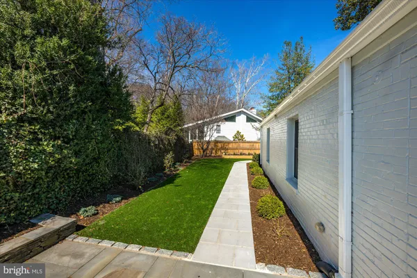 a view of house with backyard