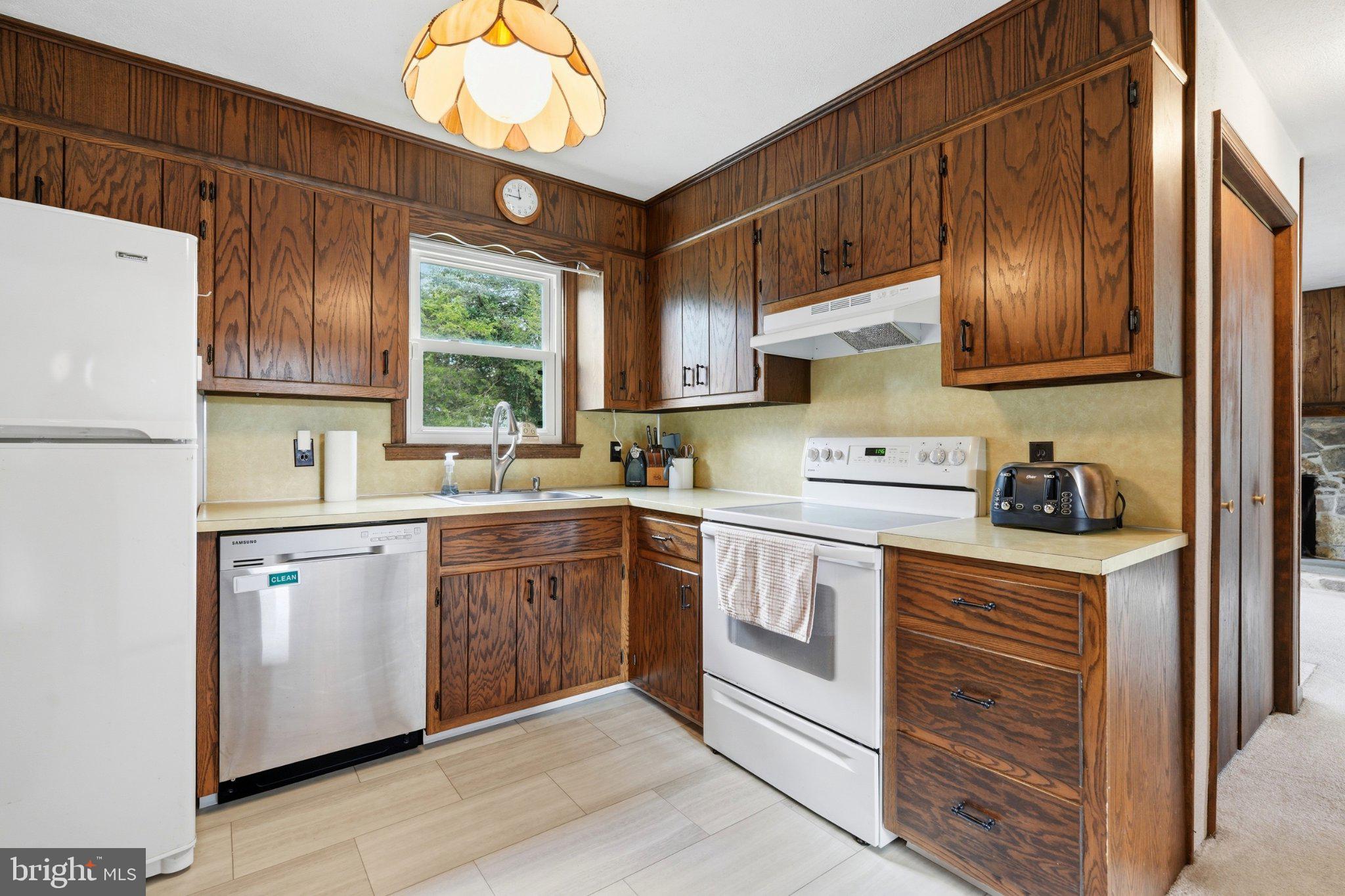 1385 Woodmere Road Pottstown, PA 19464 - Photo 13 of 63 Charming kitchen with warm wood accents.