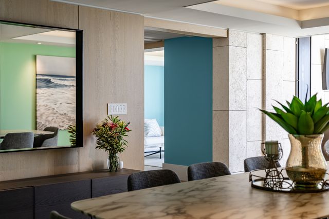 a bedroom with a large bed and a large window