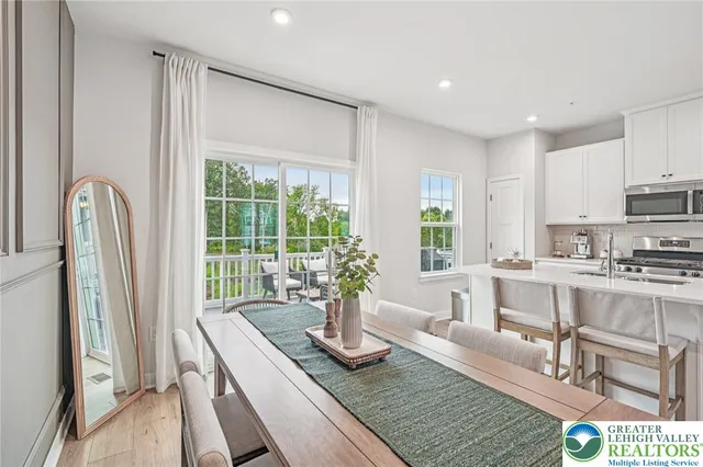 a view of kitchen with granite countertop lots of counter top space and living room