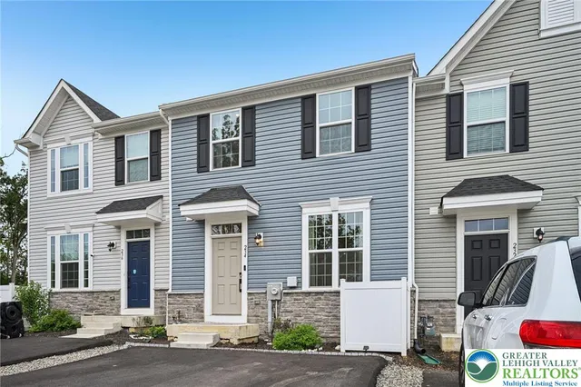 a front view of a house with garage
