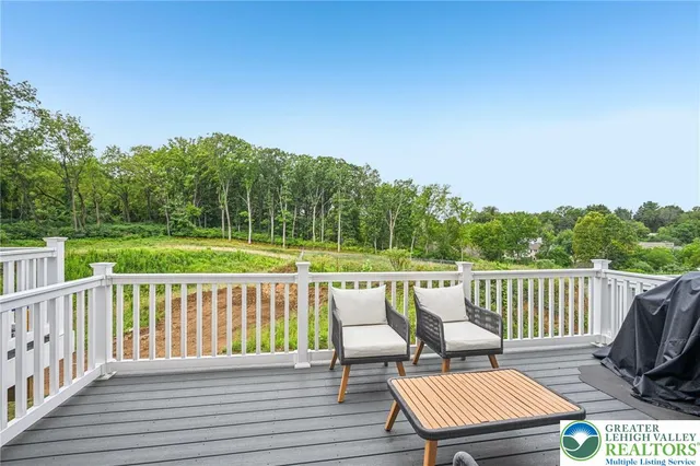 a view of a two chairs on the roof deck
