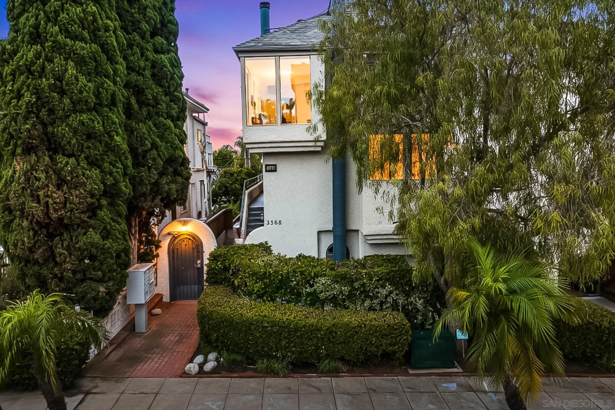 3568 Front Street, Unit D San Diego, CA 92103 - Photo 1 of 24 a front view of a house with garden