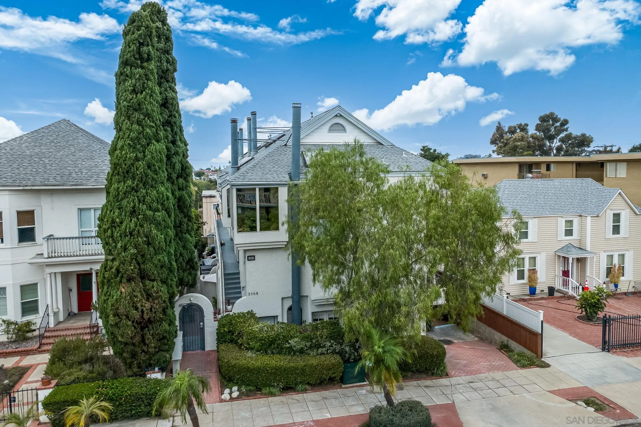 3568 Front Street, Unit D San Diego, CA 92103 - Photo 18 of 24 a front view of a house with a yard
