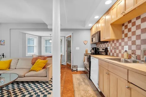 a living room with furniture and a rug