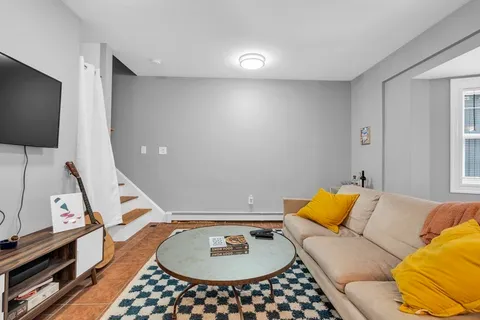 a living room with a couch and a flat screen tv