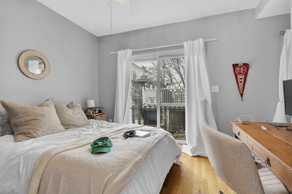 493-495 East 7th Street Boston, MA 02127 - Photo 16 of 22 a bedroom with a bed and a large window