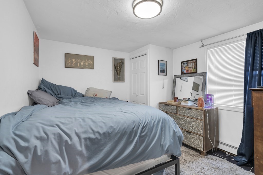 493-495 East 7th Street Boston, MA 02127 - Photo 20 of 22 a bed room with a bed and a desk