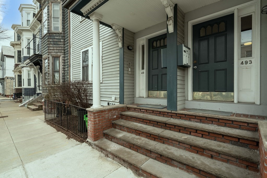 493-495 East 7th Street Boston, MA 02127 - Photo 22 of 22 a view of a house with a large windows and plants