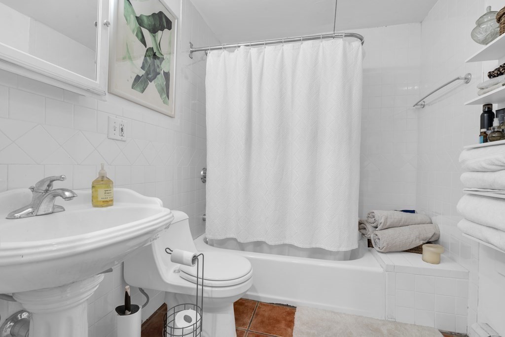 493-495 East 7th Street Boston, MA 02127 - Photo 6 of 22 a bathroom with a sink toilet and shower
